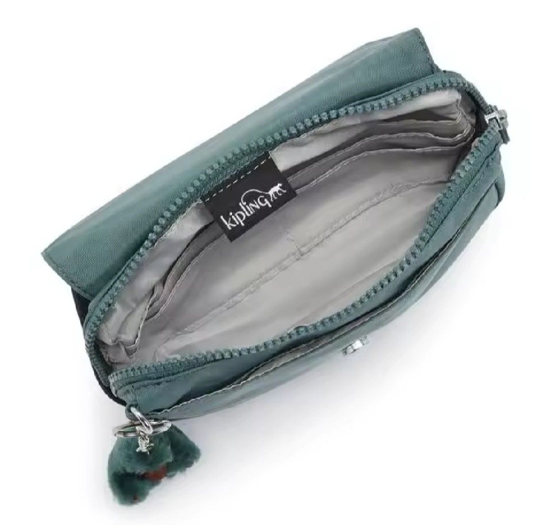 Kipling Averill Crossbody Bag Light Aloe (Category: Cross-body Bags) located in Davao. Submitted by jilly07 (Listing ID 1396519581, Image 2). Description: - Kipling Averill crossbody bag - Teal color - Adjustable strap - Flap closure - Includes Kipling monkey charm - Multiple interior compartments - Zipper closure - Kipling logo tag 👜 Brand new. Bought in Kipling Store, comes with tags and original packaging. ❌No COD/COP as I am a full time work