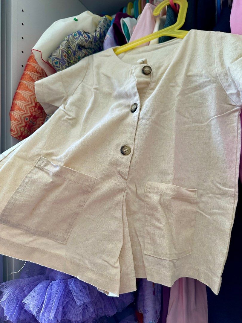 Laila & Lyra Romper (Category: Babies & Kids Fashion) located in Cavite. Submitted by Ersdecluts (Listing ID 1396527699, Image 3). Description: - Bella & Lyra cream-colored romper - Short sleeves - Button-down front - Two front pockets - Simple, classic design - Light-colored fabric.
