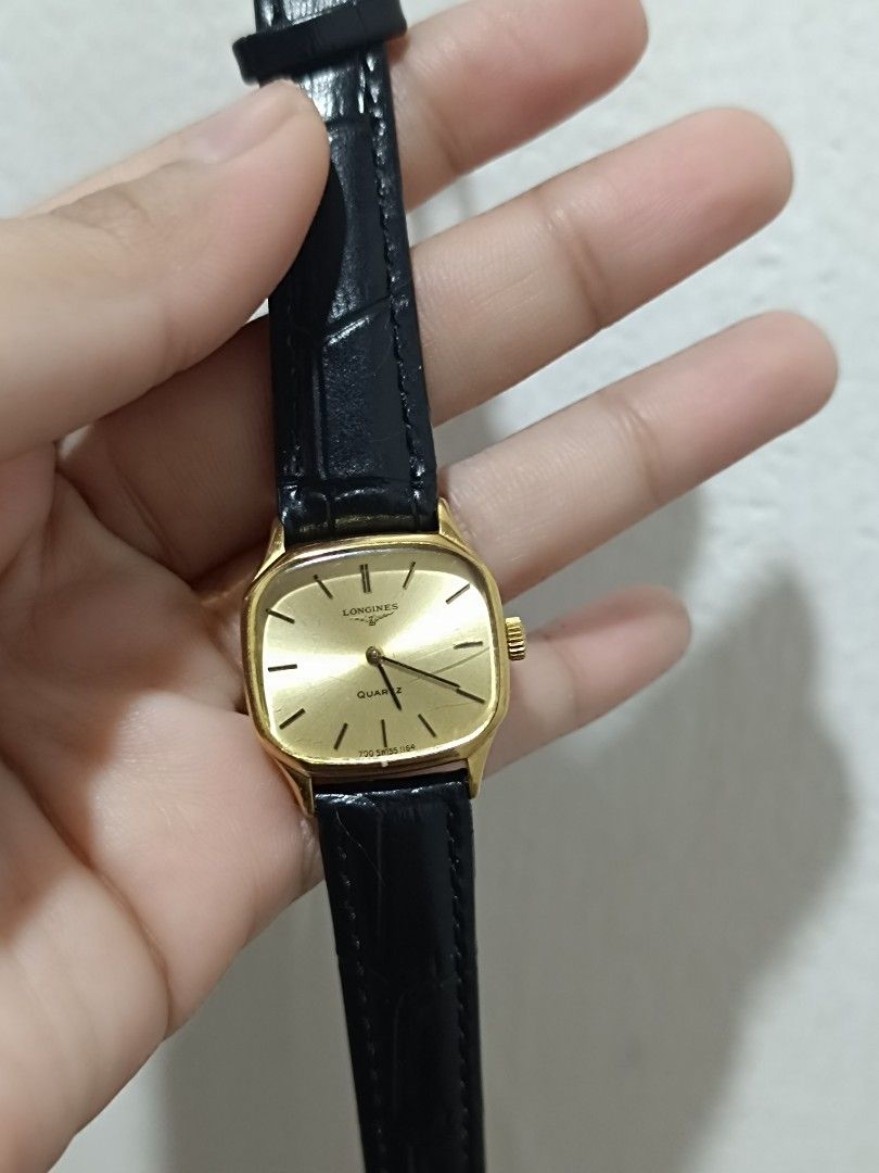 Longines Quartz Watch (Category: Luxury Watches) located in Quezon City. Submitted by maeclosetph (Listing ID 1396556390, Image 1). Description: - Longines quartz watch - Gold-toned rectangular dial - Black leather strap - Stainless steel back .