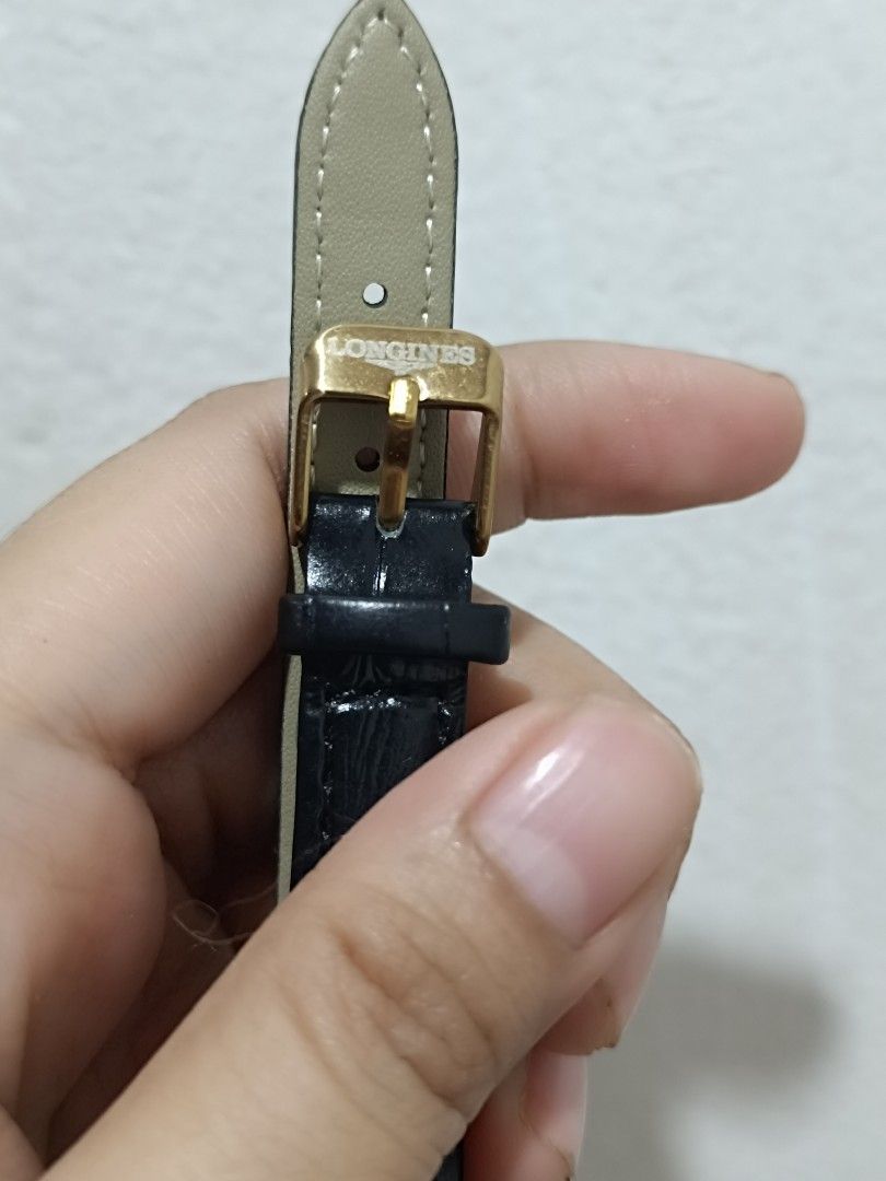 Longines Quartz Watch (Category: Luxury Watches) located in Quezon City. Submitted by maeclosetph (Listing ID 1396556390, Image 3). Description: - Longines quartz watch - Gold-toned rectangular dial - Black leather strap - Stainless steel back .