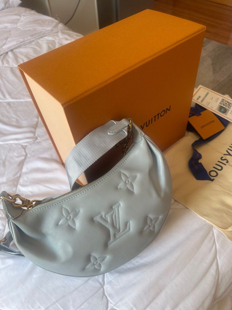 Louis Vuitton Loop Hobo Bag (Category: Luxury Bags & Wallets) located in Quezon City. Submitted by yesha1809 (Listing ID 1396632555, Image 2). Description: - Authentic Louis Vuitton Loop Hobo Bag - Color: Light Blue -Being sold for 120K online (preloved- Mariel R.) - Hardware: Gold-tone - Includes: Detachable strap & chain - Comes with original box, dust bag, and authenticity card - Features the classic Louis Vuitton logo and flower pattern.