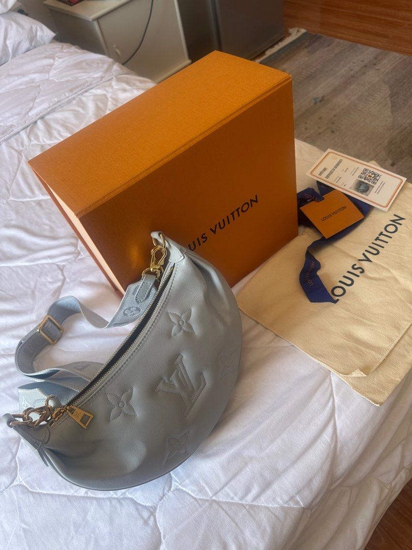 Louis Vuitton Loop Hobo Bag (Category: Luxury Bags & Wallets) located in Quezon City. Submitted by yesha1809 (Listing ID 1396632555, Image 3). Description: - Authentic Louis Vuitton Loop Hobo Bag - Color: Light Blue -Being sold for 120K online (preloved- Mariel R.) - Hardware: Gold-tone - Includes: Detachable strap & chain - Comes with original box, dust bag, and authenticity card - Features the classic Louis Vuitton logo and flower pattern.