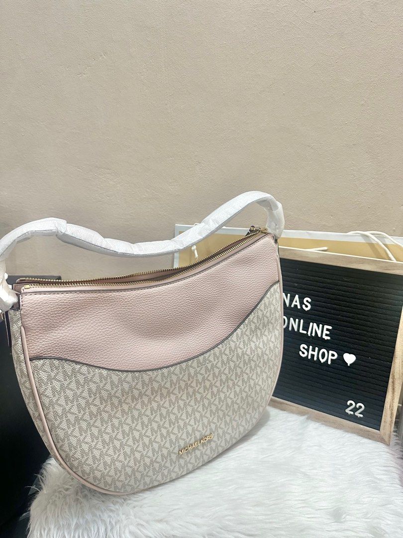 Original Michael Kors Dover Powder Blush Multi Large Half Moon Shoulder Bag (Category: Luxury Bags & Wallets) located in Las Pinas. Submitted by anasonlineshophtplaspinas (Listing ID 1396479574, Image 1). Description: Original Michael Kors Dover Powder Blush Multi Large Half Moon Shoulder Bag Made of PVC and Pebble leather. The bag features a zip closure that opens to polyester lining with one zip pocket, exterior one slip pocket at front. DETAIL