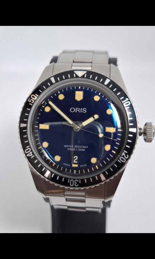 Oris 65 Swiss Made Diver Watch (Category: Luxury Watches) located in Pasig City. Submitted by charlespatricklee (Listing ID 1396663171, Image 1). Description: Oris 65 Diver Swiss Made Movement Type: Automatic with Date Calibre Oris 733, base SW 200-1 Power Reserve (h) 38hrs No. of Jewels 26 Frequency 4 Hz 28,800 vph Case Material Multi-piece stainless steel case, minutes scale top ring Case Diameter 40mm Case thickness 13mm Water Resistance 100 m