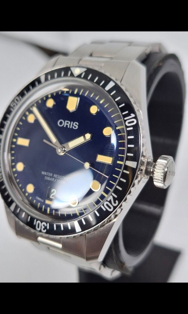 Oris 65 Swiss Made Diver Watch (Category: Luxury Watches) located in Pasig City. Submitted by charlespatricklee (Listing ID 1396663171, Image 2). Description: Oris 65 Diver Swiss Made Movement Type: Automatic with Date Calibre Oris 733, base SW 200-1 Power Reserve (h) 38hrs No. of Jewels 26 Frequency 4 Hz 28,800 vph Case Material Multi-piece stainless steel case, minutes scale top ring Case Diameter 40mm Case thickness 13mm Water Resistance 100 m
