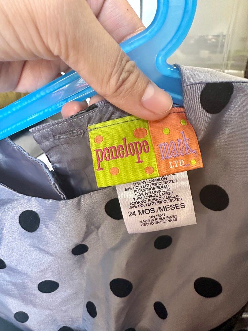 Penelope Mack Polka Dot Dress (Category: Dresses) located in Cavite. Submitted by Ersdecluts (Listing ID 1396534384, Image 2). Description: - Penelope Mack dress - Size: 24 months - Color: Gray with black polka dots - Features: Black velvet bow, back buttons - Made in the Philippines.
