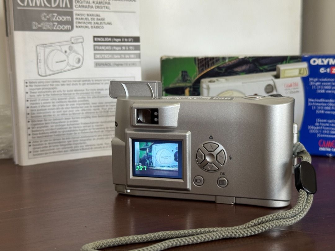 RARE Olympus C-1 Zoom Pop-up Flash Digital Camera (Category: Cameras) located in Quezon City. Submitted by niwdr0 (Listing ID 1396507243, Image 3). Description: FOR SALE ONLY: RARE 2001 Olympus C-1 Zoom “c-you” Digital Camera for 4,000 **GDrive link for samples: https://drive.google.com/drive/folders/1PHhN1bYoTTNyYyaqeWFDhz839soqD38A?usp=sharing Condition: 9.8/10 looks unused but with minor bumps and scratches on the frame (see pictures) Inclusio
