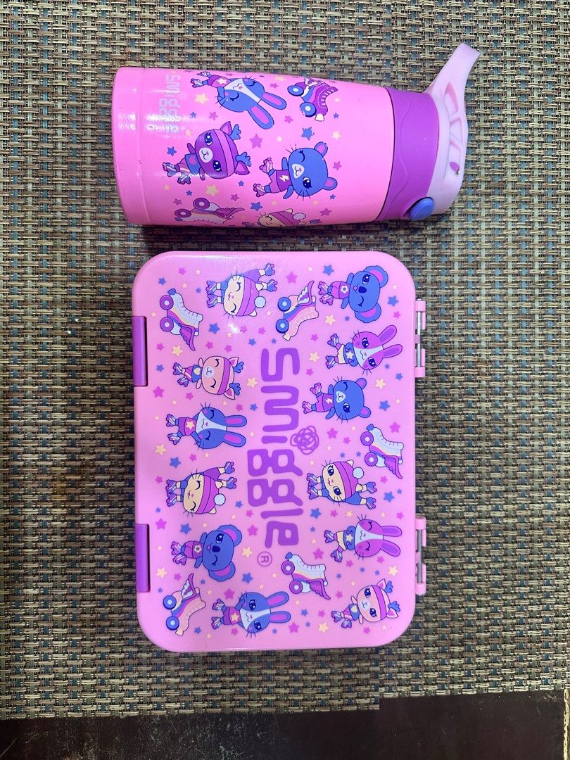 Smiggle Water Bottle and Lunchbox Set (Category: Food Organization & Storage) located in San Fernando. Submitted by km_koleksyon (Listing ID 1396663965, Image 3). Description: - Smiggle water bottle and lunchbox set. - Features a fun cartoon design. - Water bottle: Pink and purple, flip-top lid. - Lunchbox: Matching pink design. - Made of durable materials. - Ideal for kids..