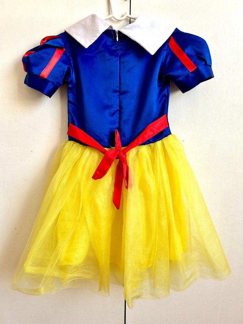 Snow White Costume with Headband (Category: Babies & Kids Fashion) located in Santa Rosa. Submitted by lovedbydane (Listing ID 1396511968, Image 2). Description: - Snow White costume - Blue bodice with red accents - Yellow tulle skirt - Includes red bow and white collar - Zipper closure with red ribbon tie - Comes with a red headband - Great for dress-up and themed parties Size 130 on tag Fits 4/6y Worn once With cape .