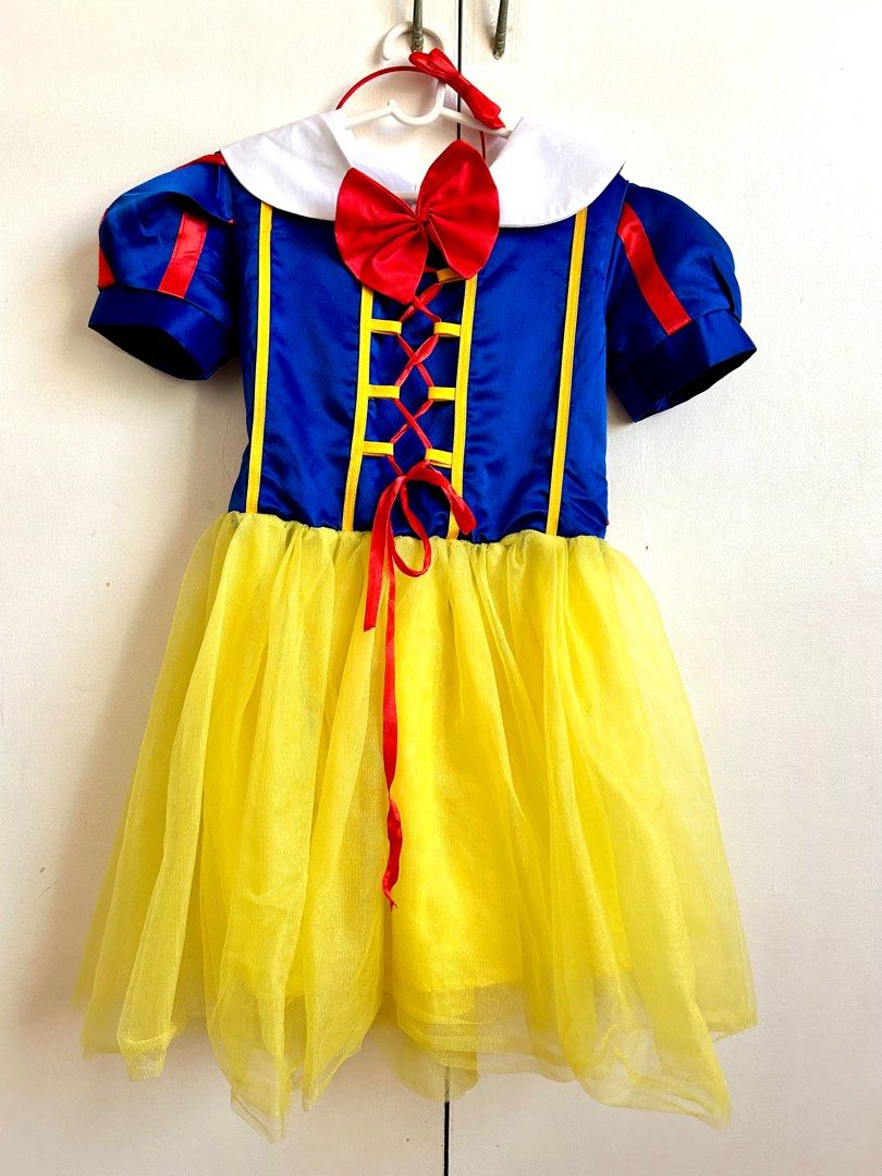Snow White Costume with Headband (Category: Babies & Kids Fashion) located in Santa Rosa. Submitted by lovedbydane (Listing ID 1396511968, Image 1). Description: - Snow White costume - Blue bodice with red accents - Yellow tulle skirt - Includes red bow and white collar - Zipper closure with red ribbon tie - Comes with a red headband - Great for dress-up and themed parties Size 130 on tag Fits 4/6y Worn once With cape .