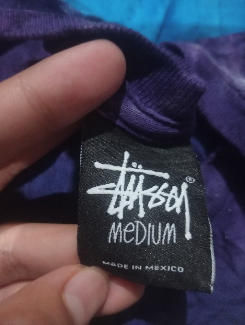 Stussy Tie-Dye T-Shirt - Medium (Category: Tshirts & Polo Shirts ) located in Bolinao. Submitted by willaskyle19427 (Listing ID 1396610244, Image 3). Description: - Authentic Stussy tie-dye t-shirt - Size: Medium - Unique gradient design (purple, blue, green) - Features the Stussy logo - Made in Mexico - Material: 100% cotton - Care label included.