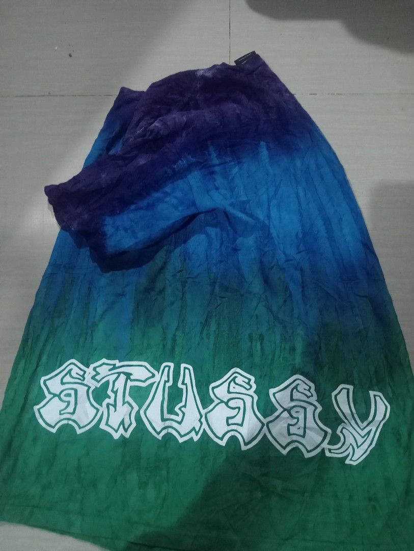 Stussy Tie-Dye T-Shirt - Medium (Category: Tshirts & Polo Shirts ) located in Bolinao. Submitted by willaskyle19427 (Listing ID 1396610244, Image 1). Description: - Authentic Stussy tie-dye t-shirt - Size: Medium - Unique gradient design (purple, blue, green) - Features the Stussy logo - Made in Mexico - Material: 100% cotton - Care label included.