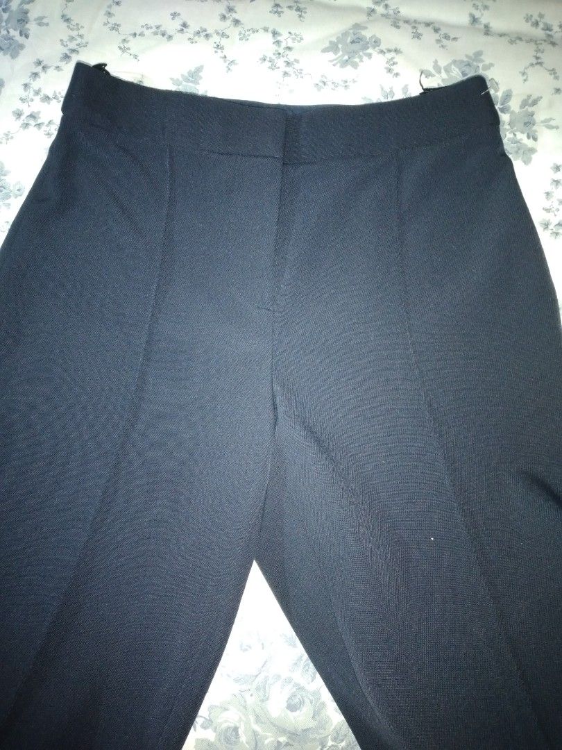 Tory Burch Navy Blue Trouser (Category: Other Bottoms) located in Makati City. Submitted by closet.declutterph (Listing ID 1396592618, Image 2). Description: - Tory Burch pants - Color: Navy blue - Style: Straight leg - Size: 28, Length: 38inches - Material: Woven fabric - Features: Clean, tailored look - Versatile for various occasions.