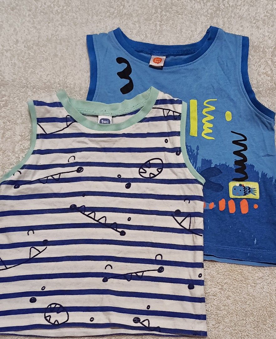 Tuctuc Tank Tops - 12 Months (Category: Babies & Kids Fashion) located in Quezon City. Submitted by lion_s (Listing ID 1396656825, Image 1). Description: kindly wash before use - Bundle of two Tuctuc tank tops (UK brand) - Size: 12 months - Includes: - Blue and white striped tank top with dinosaur design - Blue tank top with various graphic designs and the number "3" - Price: 90 pesos.