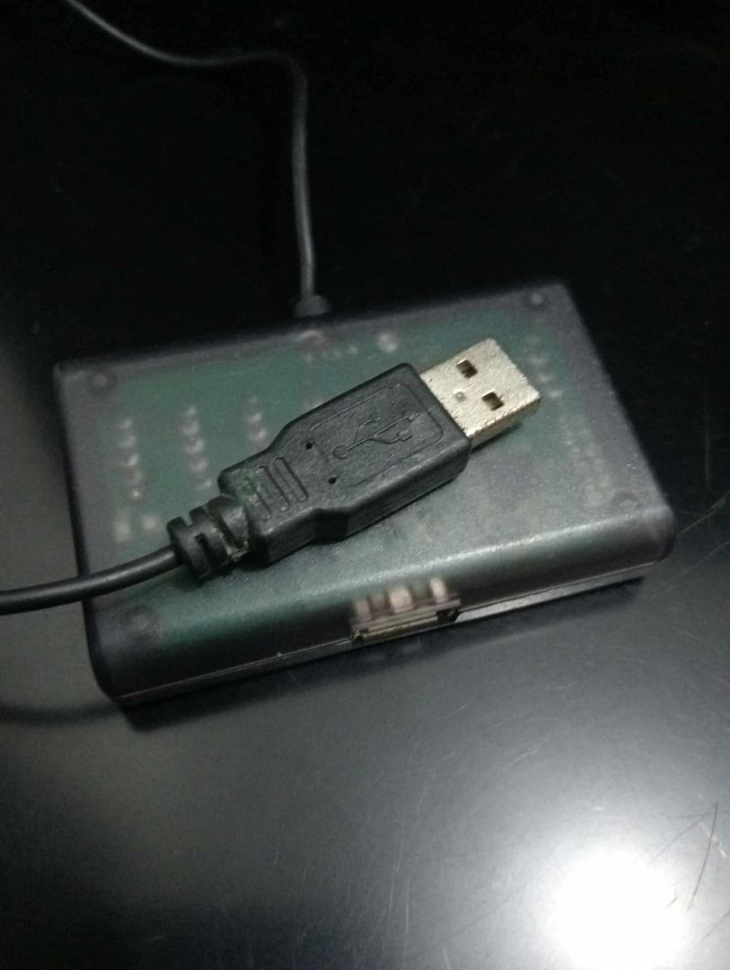 Xbox 360 Controller Adapter for PS3 (Category: Controllers) located in Quezon City. Submitted by potfishcake (Listing ID 1396517626, Image 2). Description: - Play your PS3 games with your Xbox 360 controller! - USB connection for easy setup. - Features button customization switches. - Includes a 'TURBO' setting for rapid-fire action. - Sleek black design with a clear plastic cover..
