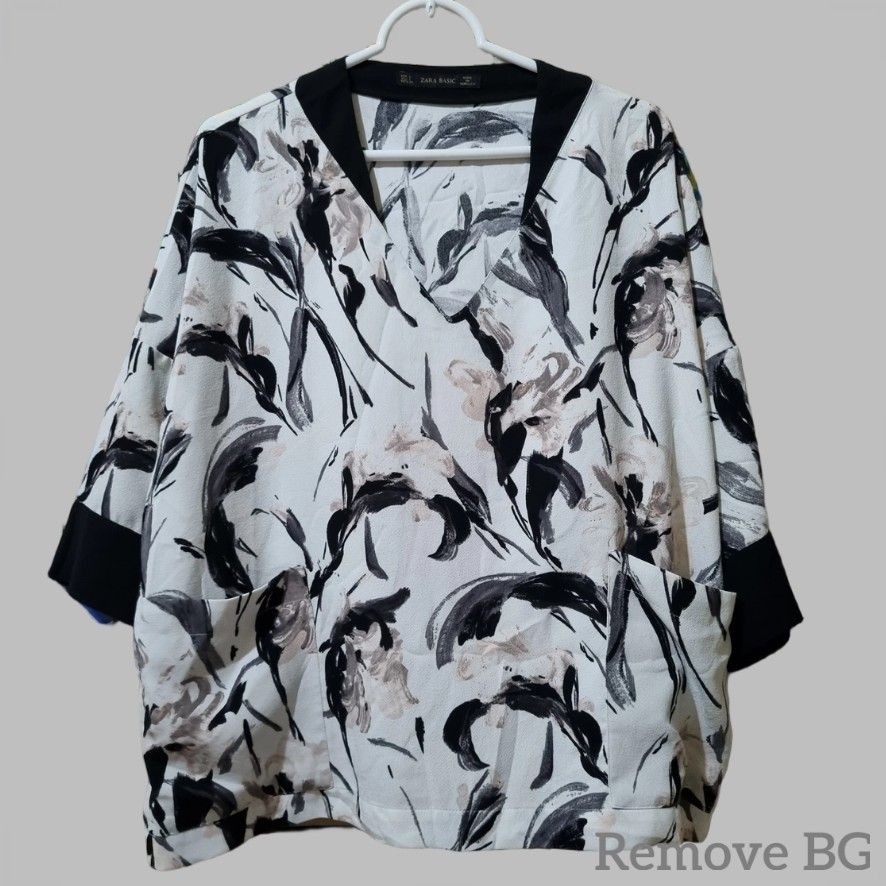 Zara Basic Floral Blouse (Category: Blouses) located in Quezon City. Submitted by stylemd (Listing ID 1396481137, Image 1). Description: - Zara Basic floral blouse - Size: L - Features a V-neck - Black trim on collar and sleeves - Two pockets - Made in Morocco.
