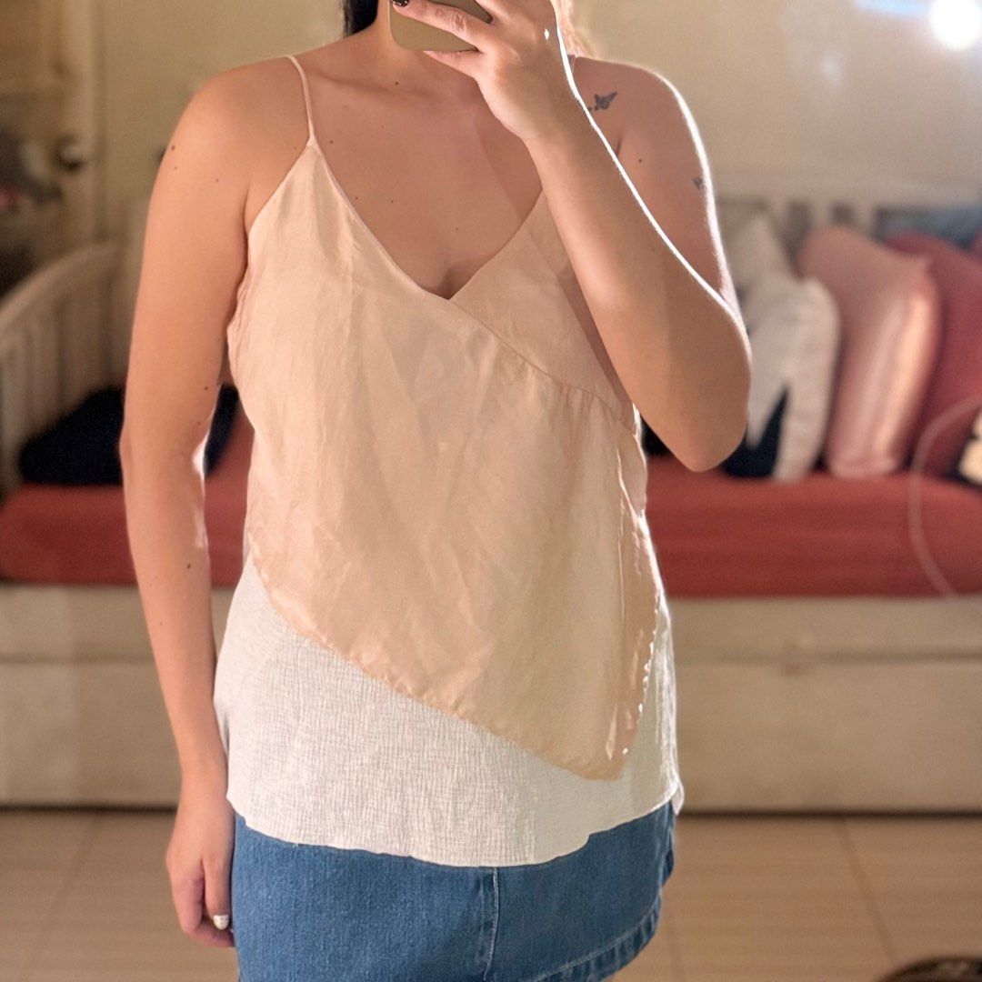 Zara Collection Layered Cami Top (Category: Sleeveless) located in Valenzuela. Submitted by mango____ (Listing ID 1396579620, Image 1). Description: - Zara Cami Top - Layered design - Beige color with white underlay - V-neckline - Spaghetti straps.