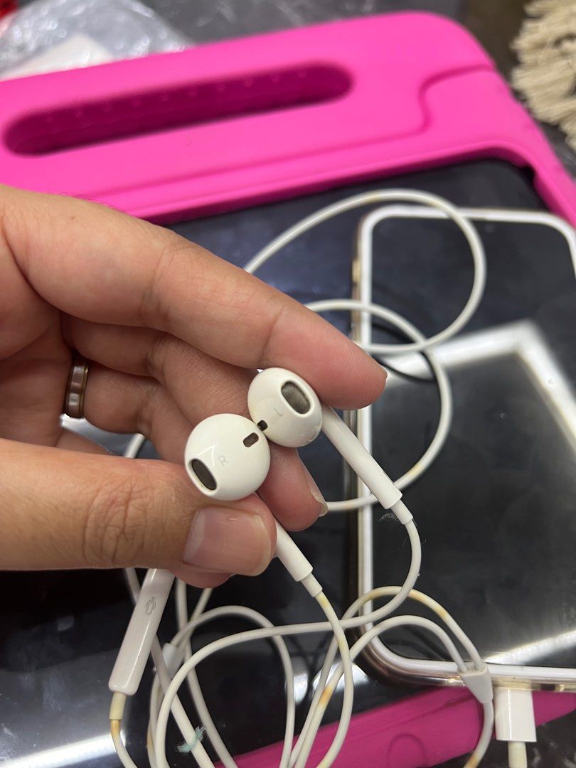 Apple EarPods with Lightning Connector (Category: Earphones) located in Caloocan City. Submitted by axljimenez94043 (Listing ID 1396713587, Image 3). Description: - Apple Earpods with Lightning Connector - Includes earphones and lightning connector - Features volume control buttons - Cable and connector show some discoloration - Earphones marked with 'R' and 'L' for right and left All are working!!! Pm me for details. .