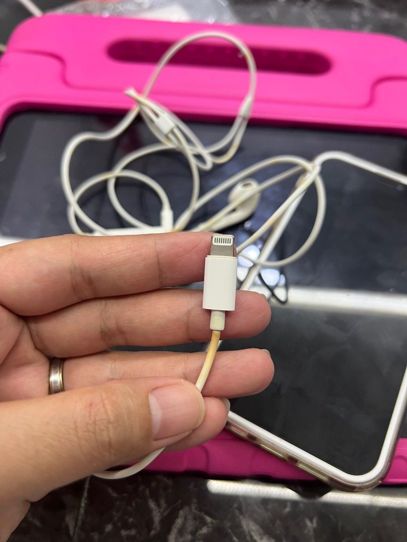 Apple EarPods with Lightning Connector (Category: Earphones) located in Caloocan City. Submitted by axljimenez94043 (Listing ID 1396713587, Image 2). Description: - Apple Earpods with Lightning Connector - Includes earphones and lightning connector - Features volume control buttons - Cable and connector show some discoloration - Earphones marked with 'R' and 'L' for right and left All are working!!! Pm me for details. .