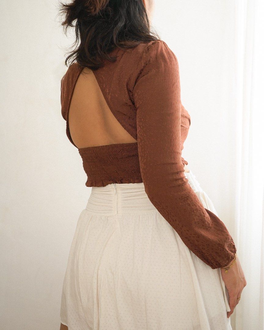 Brown Long Sleeve Milkmaid Crop Top (Category: Longsleeves) located in Manila. Submitted by fayealmo (Listing ID 1396733033, Image 2). Description: — fits XS to Small — stretchable, smocked back — slightly textured with animal print patter — garterized cuffs — keyhole open back detail — bust: up to 34in — length: 15in — sleeves: 23in.