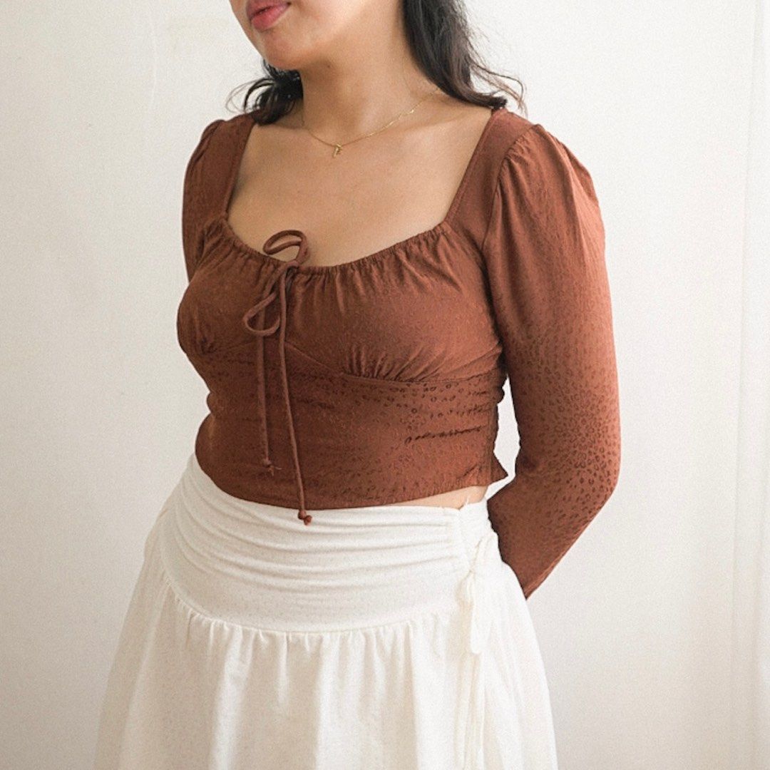 Brown Long Sleeve Milkmaid Crop Top (Category: Longsleeves) located in Manila. Submitted by fayealmo (Listing ID 1396733033, Image 1). Description: — fits XS to Small — stretchable, smocked back — slightly textured with animal print patter — garterized cuffs — keyhole open back detail — bust: up to 34in — length: 15in — sleeves: 23in.