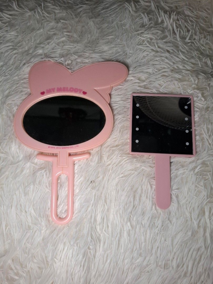 BUNDLE Hand Mirror (Category: Mirrors) located in San Isidro. Submitted by d.clutter_stuffs (Listing ID 1396794700, Image 1). Description: - My Melody Mirror (Bendable) - Mini Hand Mirror (has Lights) ‼️ NO COD.