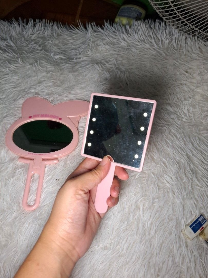 BUNDLE Hand Mirror (Category: Mirrors) located in San Isidro. Submitted by d.clutter_stuffs (Listing ID 1396794700, Image 2). Description: - My Melody Mirror (Bendable) - Mini Hand Mirror (has Lights) ‼️ NO COD.