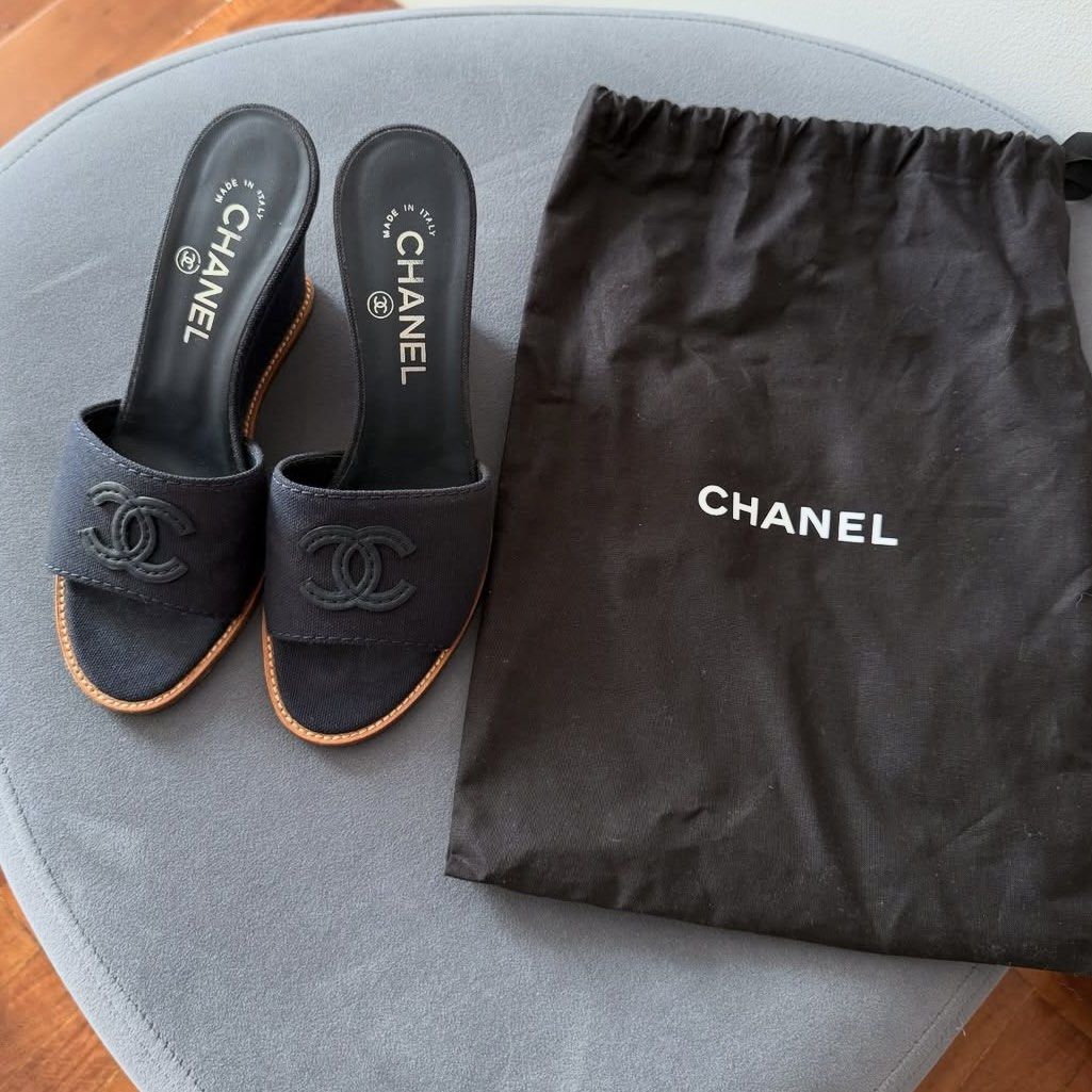 Chanel Wedge Sandals (Category: Sneakers & Footwear) located in Manila. Submitted by declutterrrrrrrph (Listing ID 1396710513, Image 1). Description: - Authentic Chanel wedge sandals - Features iconic Chanel logo -23.5 cm/ bought for 50k - Made in Italy - Includes dust bag - Soles show wear.