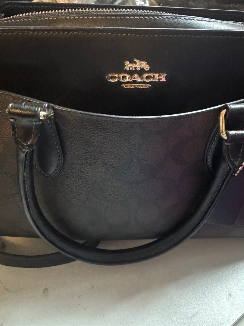 Coach Darcie Carryall Bag (Category: Luxury Bags & Wallets) located in Manila. Submitted by anneg15677 (Listing ID 1396740610, Image 2). Description: - Coach Darcie Carryall bag - Signature canvas - Color: Brown and black - Gold hardware - Includes top handle and shoulder strap - Zip closure - Coach logo on front - Lined interior Last 2 photos for reference only.
