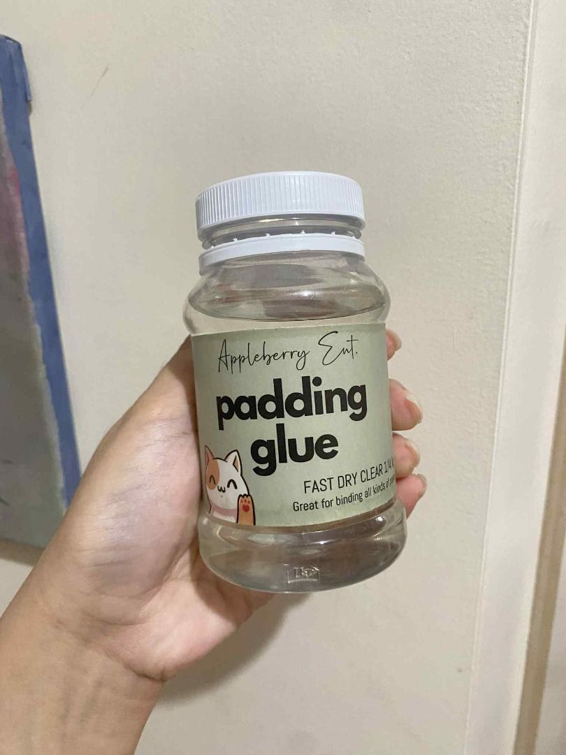 Fast-Dry Padding Glue for DIY Notebooks, Notepads, and Craft Binding (Category: Craft Supplies & Tools) located in Paranaque City. Submitted by aruaree (Listing ID 1396738784, Image 1). Description: Excellent Condition (Almost New): Used only once for a mini notepad. Product is still full. Bought January 2024. Shipping available via Lalamove or Move-It. Delivery fee is shouldered and c/o buyer..