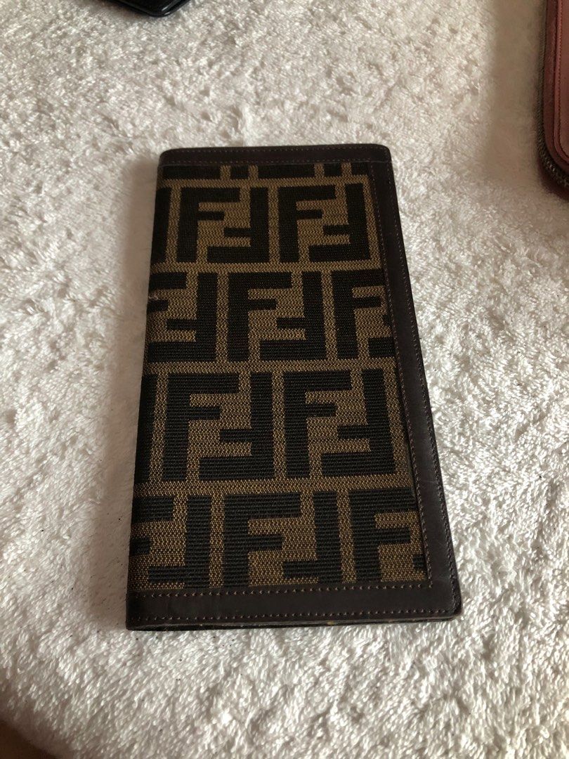Fendi flat wallet cheque or passport holder (Category: Luxury Bags & Wallets) located in Pasig City. Submitted by maricrism68145 (Listing ID 1396703389, Image 1). Description: preloved from Japan,100% authentic,flat wallet,unisex,passport holder.
