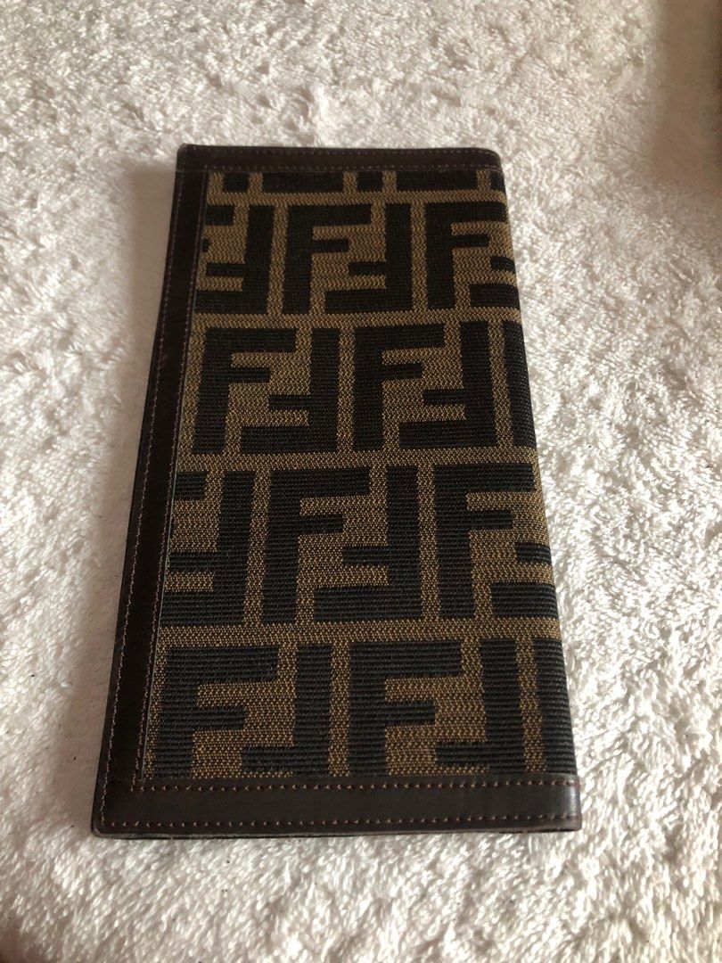 Fendi flat wallet cheque or passport holder (Category: Luxury Bags & Wallets) located in Pasig City. Submitted by maricrism68145 (Listing ID 1396703389, Image 2). Description: preloved from Japan,100% authentic,flat wallet,unisex,passport holder.