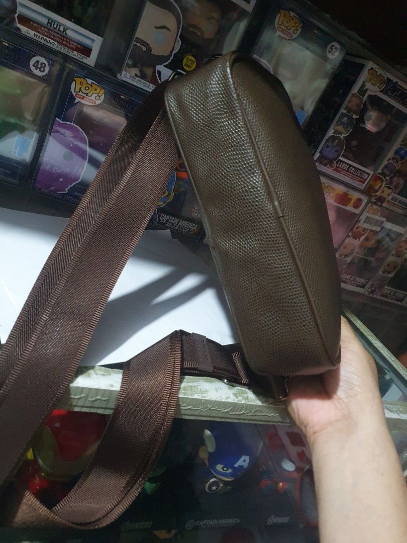 Hardy Amies Crossbody Bag (Category: Luxury Bags & Wallets) located in Quezon City. Submitted by pongoy (Listing ID 1396720370, Image 3). Description: - Brand: Hardy Amies - Style: Crossbody bag - Features: Textured finish, adjustable strap, zip closure - Design: Rectangular shape, classic design - Perfect for everyday use.