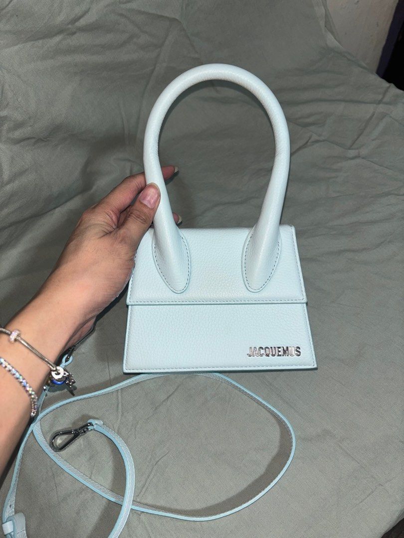 Jacquemus Le Chiquito Moyen (medium size) (Category: Luxury Bags & Wallets) located in Taguig. Submitted by sweetthing22 (Listing ID 1396828884, Image 2). Description: Jacquemus Le Chiquito Moyen bag in Grained leather Bought via Ounass Uae Color Blue Comes with detachable strap, Dustbag, Ounass box. The Le Chiquito Moyen bag from Jacquemus takes its inspiration from the streets of Paris. Made in Italy, the trapezoid handbag is crafted from leath