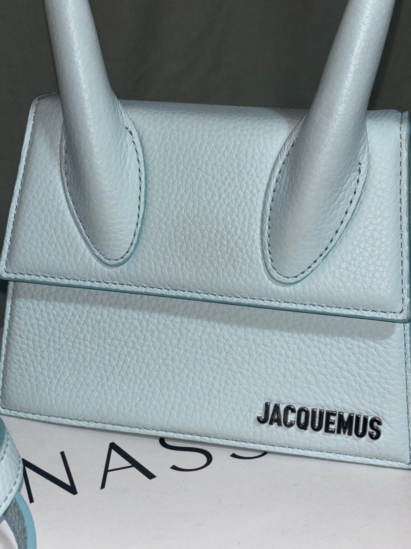 Jacquemus Le Chiquito Moyen (medium size) (Category: Luxury Bags & Wallets) located in Taguig. Submitted by sweetthing22 (Listing ID 1396828884, Image 3). Description: Jacquemus Le Chiquito Moyen bag in Grained leather Bought via Ounass Uae Color Blue Comes with detachable strap, Dustbag, Ounass box. The Le Chiquito Moyen bag from Jacquemus takes its inspiration from the streets of Paris. Made in Italy, the trapezoid handbag is crafted from leath