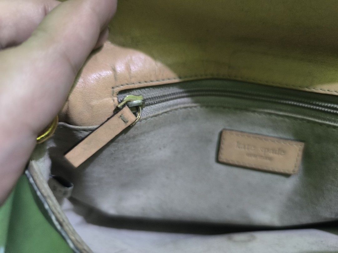 Kate Spade Grey Crocodile-Embossed Handbag (Category: Luxury Bags & Wallets) located in Quezon City. Submitted by mitchrebur80628 (Listing ID 1396691870, Image 3). Description: - Kate Spade handbag - Grey crocodile-embossed exterior - Top handle - Flap closure - Tan interior - Interior zipper pocket - Gold-toned zipper pull - Kate Spade label inside - Clutch or small shoulder bag.