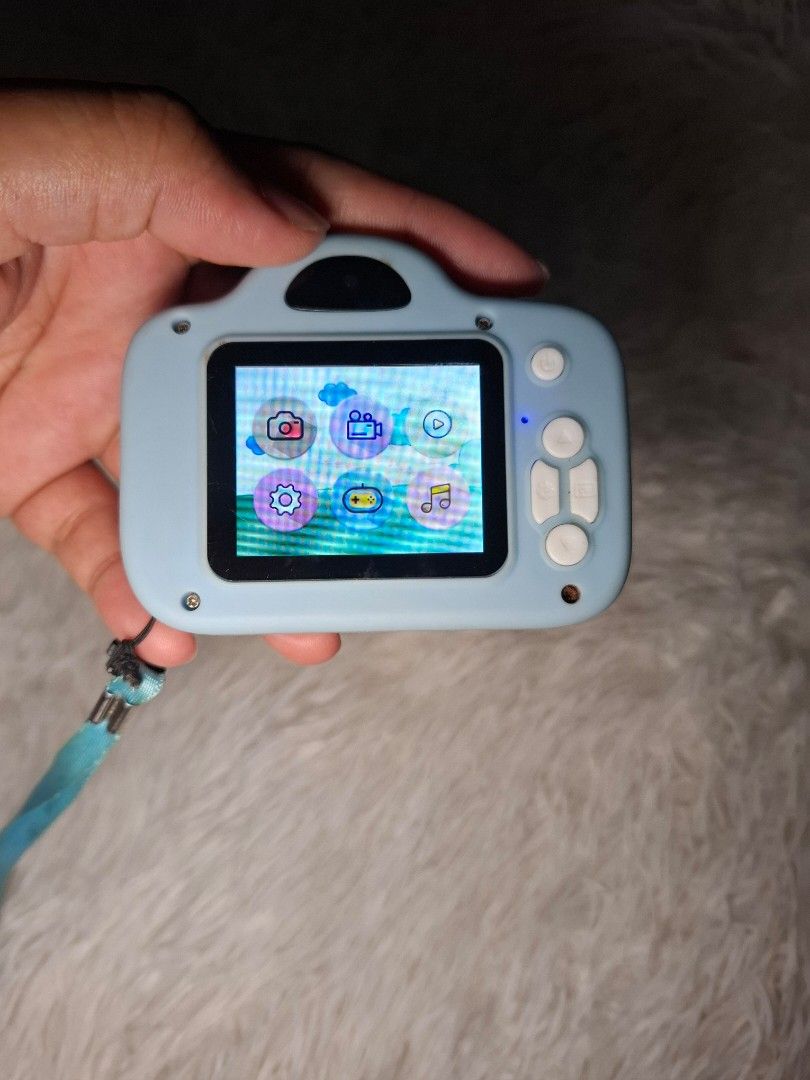 Kids Digital Camera (Category: Cameras) located in San Isidro. Submitted by d.clutter_stuffs (Listing ID 1396788370, Image 2). Description: - Light blue digital camera for kids - Features a screen for easy viewing - Simple buttons for easy operation - Comes with a blue neck strap - In good working condition.