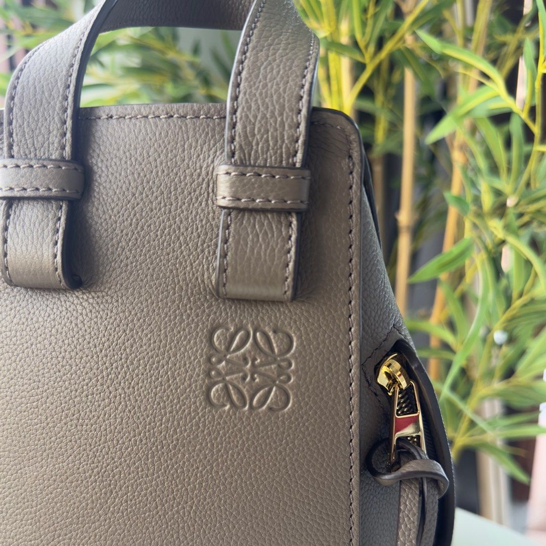 Loewe Hammock (Small) (Category: Luxury Bags & Wallets) located in Cotabato. Submitted by veriteluxebyrozi (Listing ID 1396825591, Image 3). Description: L oewe Hammock Small Bag in Taupe Authentic | Rank SA (used twice; boutique bought) Inclusion: Box, paper bag, dust bag, care card, store receipt For more information, kindly visit our website: https://rozibagsandaccessories.com/products/loewe-hammock-small-bag-in-taupe.