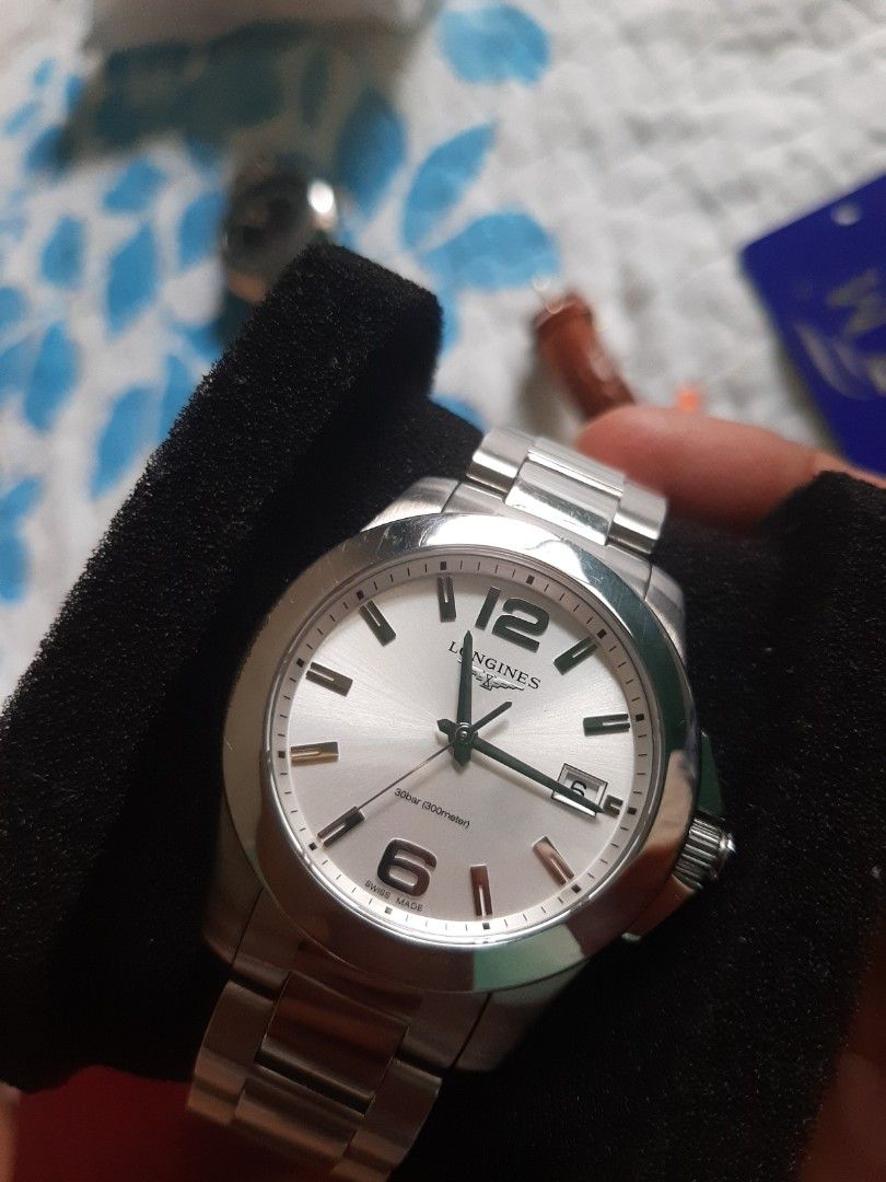 Longines HydroConquest Watch (Category: Luxury Watches) located in Cagayan de Oro. Submitted by purelion.ff7d09 (Listing ID 1396688411, Image 3). Description: - Longines HydroConquest watch - Silver dial - Stainless steel bracelet - Date display at 3 o'clock - Silver bezel - Deployment clasp - Longines logo on dial and clasp - Comes with original box.