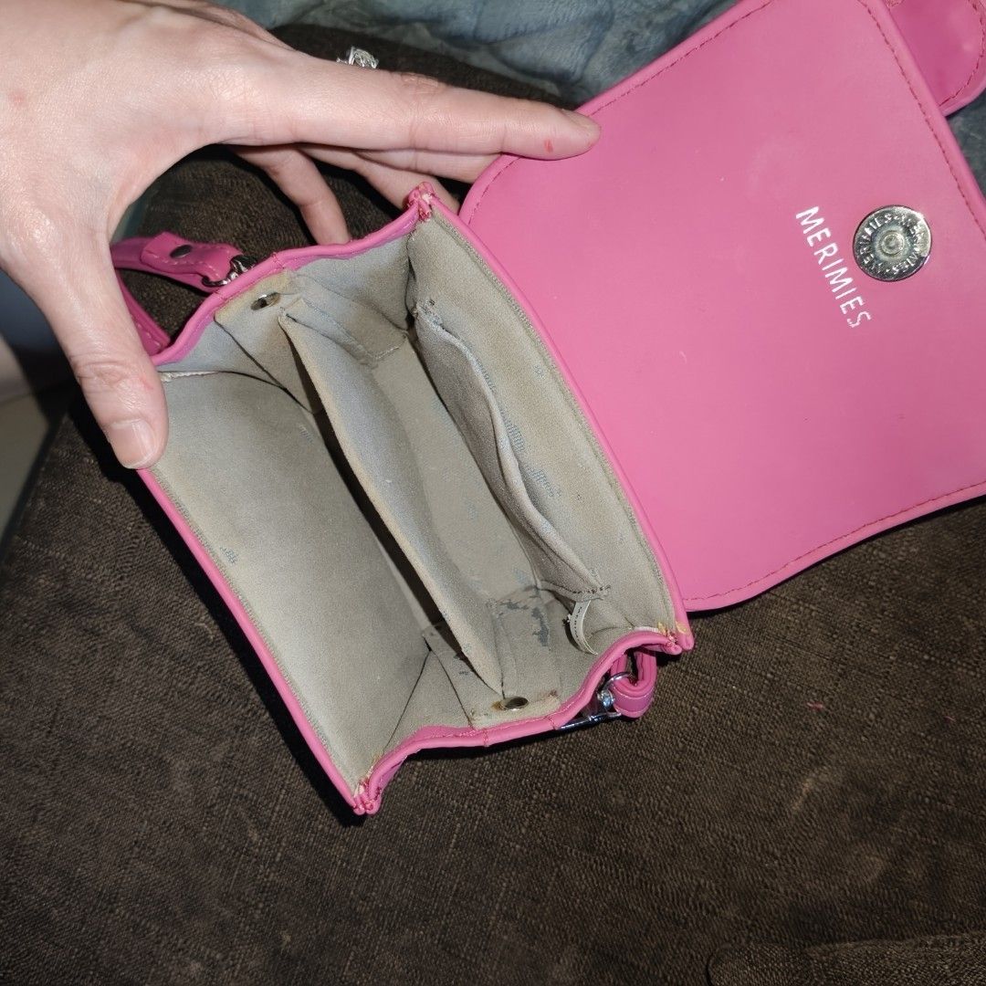 Micro Merimies Pink Crossbody Bag (Category: Cross-body Bags) located in Angono. Submitted by mel8704 (Listing ID 1396676475, Image 2). Description: -orig gorgeous Merimies Micro pink crossbody bag - Flap closure with decorative buckles - Multiple interior compartments - Includes a shoulder strap - Vibrant pink color - Made of smooth material ✅Meetup pickup angono rizal.