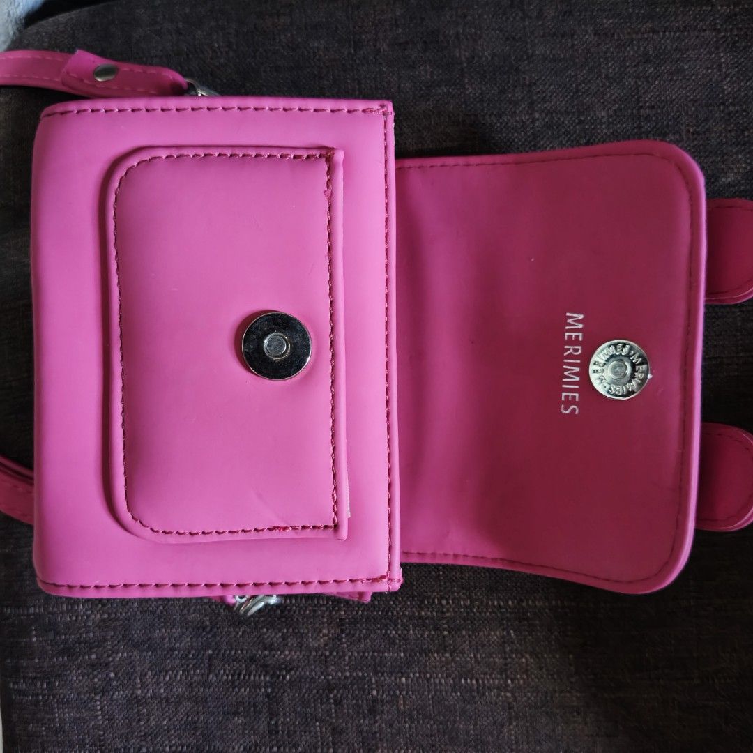 Micro Merimies Pink Crossbody Bag (Category: Cross-body Bags) located in Angono. Submitted by mel8704 (Listing ID 1396676475, Image 3). Description: -orig gorgeous Merimies Micro pink crossbody bag - Flap closure with decorative buckles - Multiple interior compartments - Includes a shoulder strap - Vibrant pink color - Made of smooth material ✅Meetup pickup angono rizal.