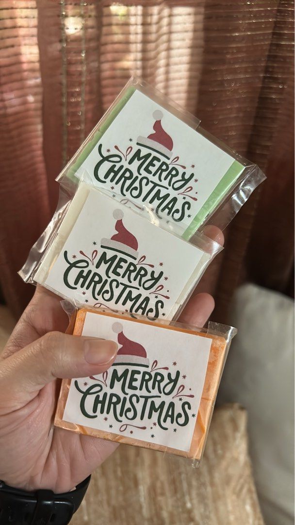 Merry Christmas Gift (Category: Bath) located in Pasig City. Submitted by mikkahale41501 (Listing ID 1396722111, Image 1). Description: - Soap Christmas gift - Available in green, white, and orange - Features a Santa hat design - Says "Merry Christmas" - Perfect for gifts - Individually wrapped.