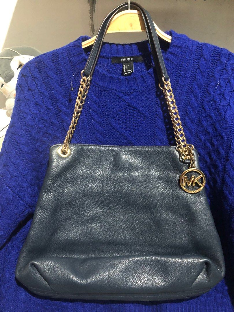 Original Michael Kors MK Slouchy Shoulder Bag (Category: Luxury Bags & Wallets) located in Manila. Submitted by rshay (Listing ID 1396796399, Image 2). Description: 🛍ALL MUST GO! Prices are negotiable, just make an offer! 🛍Preloved; looks new condition; medium-large size; gold hardwares; super nice in actual 🎀 All items are personal preloved unless stated as brand new/never used. Please manage your expectation as this item is preloved. 🎀Other