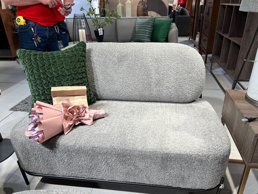 Modern Gray Boucle Sofa Mini 2-seater (Category: Sofas) located in Quezon City. Submitted by summerhues.co (Listing ID 1396717576, Image 1). Description: - Stylish gray boucle sofa - Modern design - Single-seat configuration with rounded back - Black metal frame - Includes a green textured pillow - Ideal for small apartments Location: QC Payment: Gcash or BPI Bought for 29,950 In great condition!.