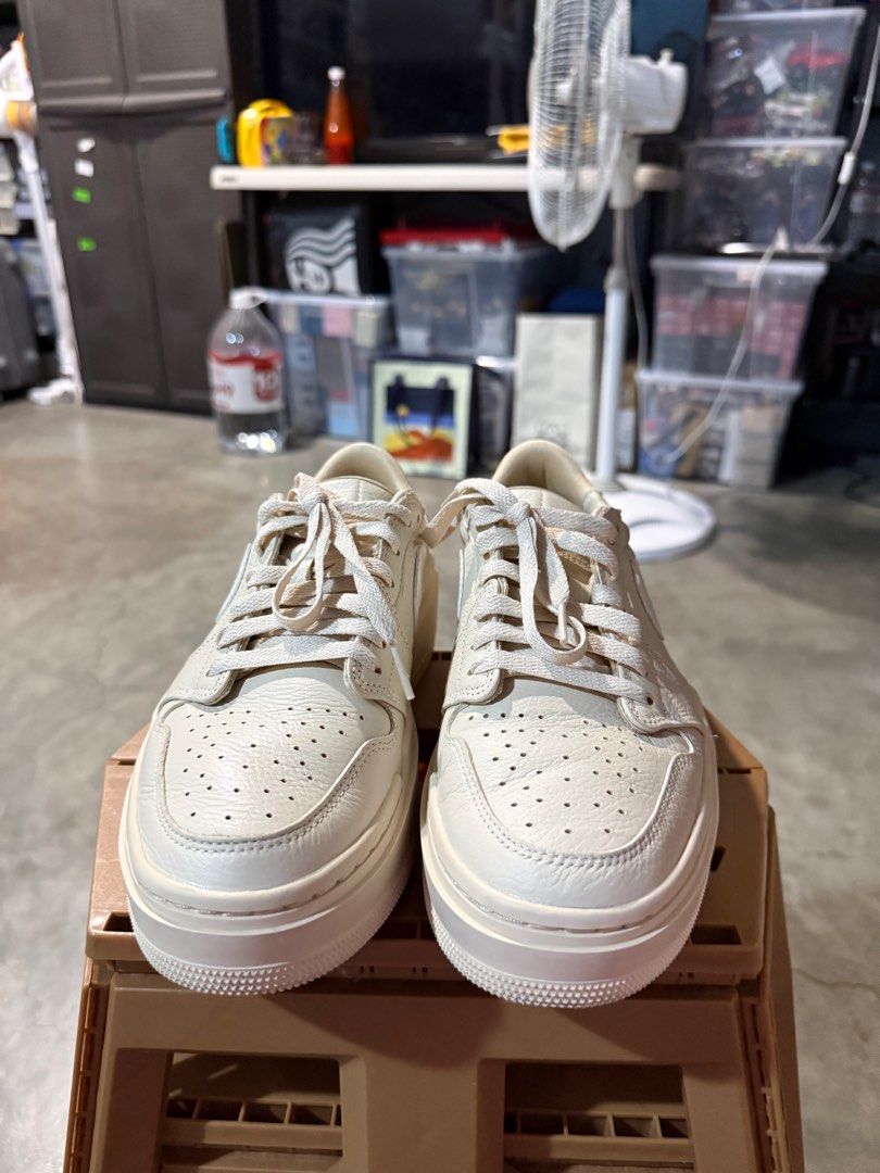 Nike Air Jordan 1 Elevate Low (Category: Sneakers) located in Bulacan. Submitted by rich3lle (Listing ID 1396705109, Image 2). Description: - Cream-colored Nike Air Jordan 1 Low Platform sneakers - Features the iconic Nike swoosh - Platform sole - Signs of wear on soles - Classic Jordan silhouette.