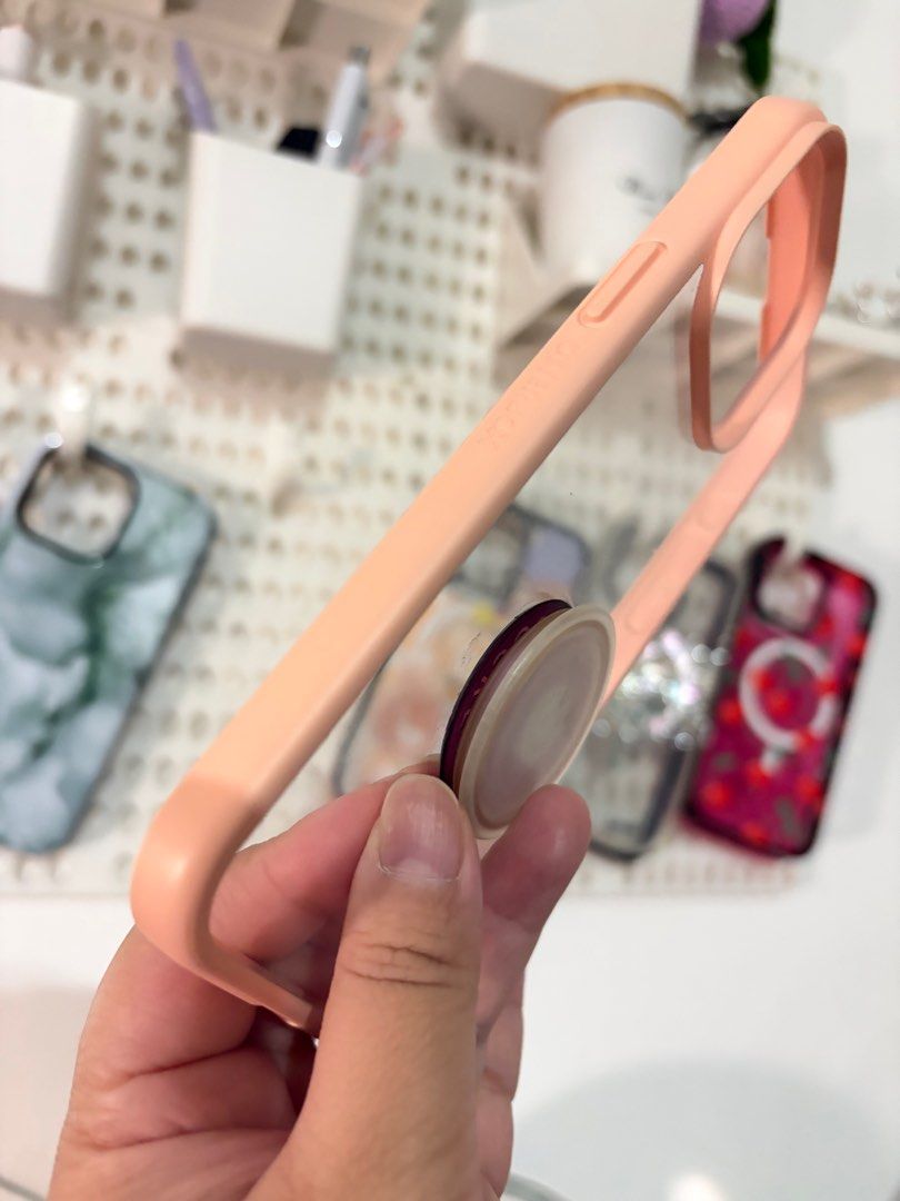 Otterbox React Perfect Peach iPhone 15 pro max (Category: Cases & Sleeves) located in Bulacan. Submitted by dianiniiiii (Listing ID 1396798699, Image 2). Description: Otterbox React for ip15pm in Perfect Peach ✨ May nakaattach na original popsocket. ✨ Pwede naman remove if di nyo bet 😁 ✨ Needs cleaning yung side. Dahil sa material nya plus light colored pa, mabilis kapitan ng dumi 😅 Iphone 15pm iphone15promax iphone 15 pro max.