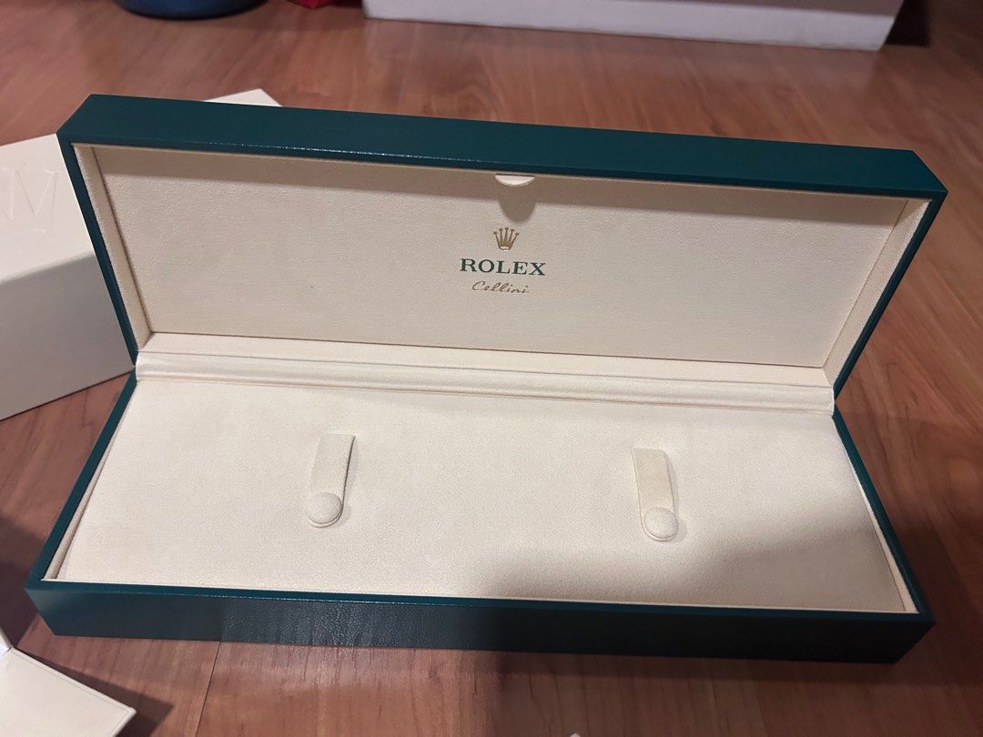 Rolex Cellini Watch Box (Category: Luxury Watches) located in Quezon City. Submitted by anneh13 (Listing ID 1396815633, Image 3). Description: - Authentic Rolex Cellini watch box set. - Includes: - Outer white box with Rolex logo. - Inner green box with cream-colored interior and Rolex logo. - Inner box features the Rolex logo. - Outer box features the Rolex logo. - Green box features the Cellini logo. -Brand new condition -no meetups -ships from