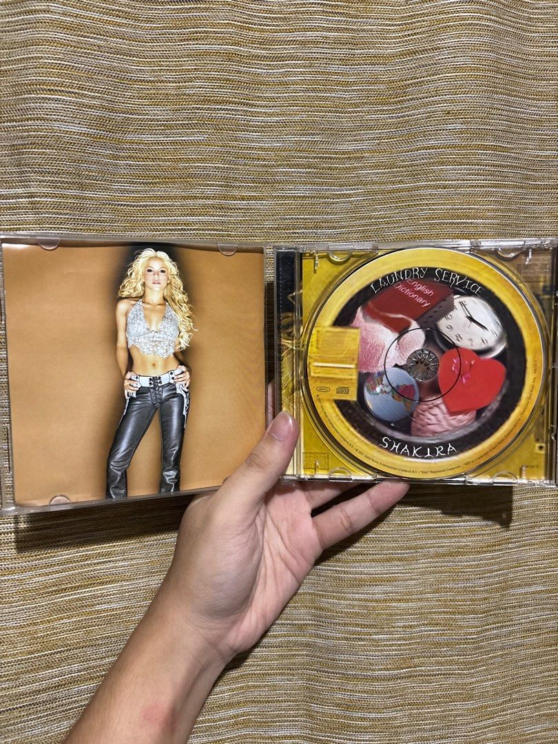 Shakira - (SIGNED) Laundry Service CD (VERY RARE!) (Category: CDs & DVDs) located in Manila. Submitted by gerger13 (Listing ID 1396814923, Image 3). Description: - Shakira's 'Laundry Service' CD - Features very rare album cover with Shakira's signature - Includes CD case and disc - Tracklist visible on the back.