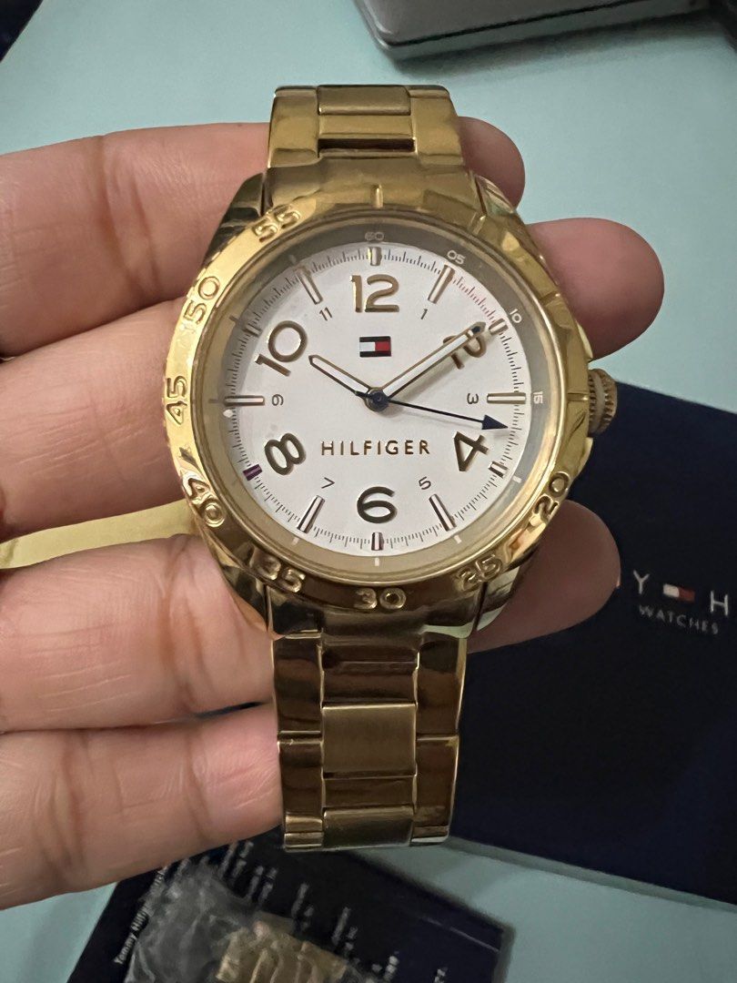 Tommy Hilfiger Gold Watch (Category: Women's Watches) located in Makati City. Submitted by the.archives (Listing ID 1396668250, Image 2). Description: Gold-toned Tommy Hilfiger watch. Includes the original box, extra links and manual. .