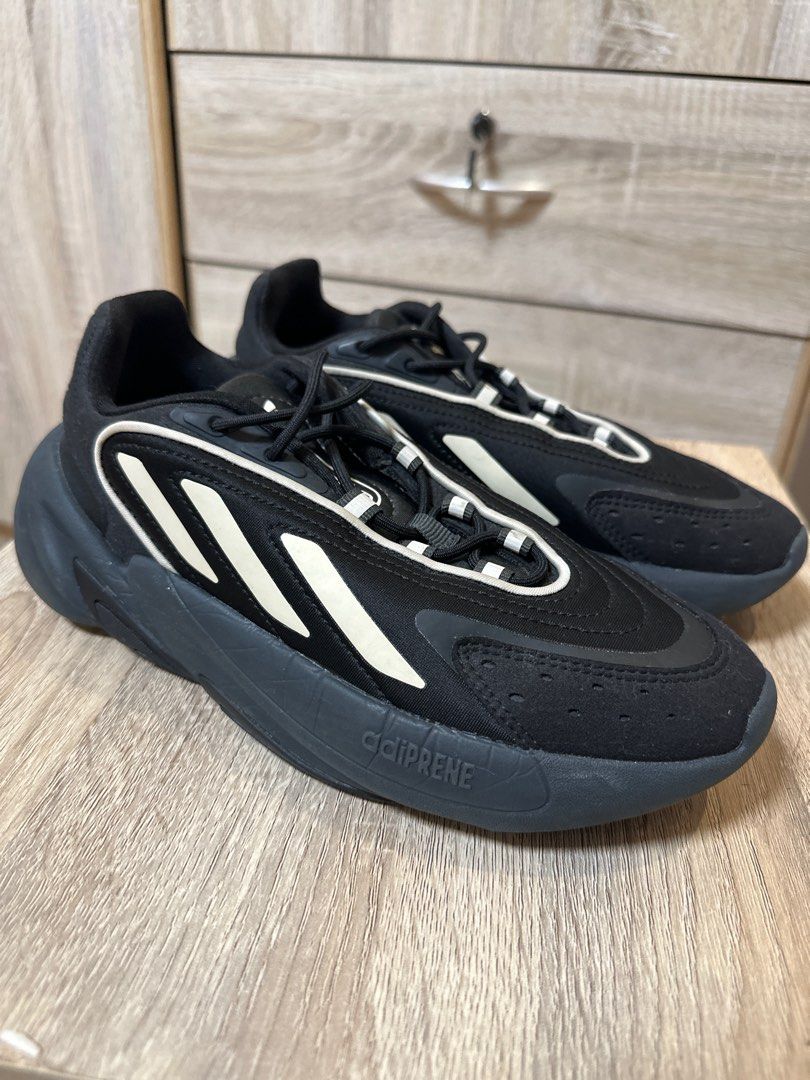 Adidas Ozelia Black Sneakers (Category: Sneakers) located in Marikina City. Submitted by samcmkhaye (Listing ID 1396953676, Image 3). Description: - Adidas Ozelia sneakers - Color: Black with white accents - Adidas logo on tongue and heel - Sole: Dark grey with 'adiprene' detail - Made in Cambodia - Lace-up closure - Size: 5 .
